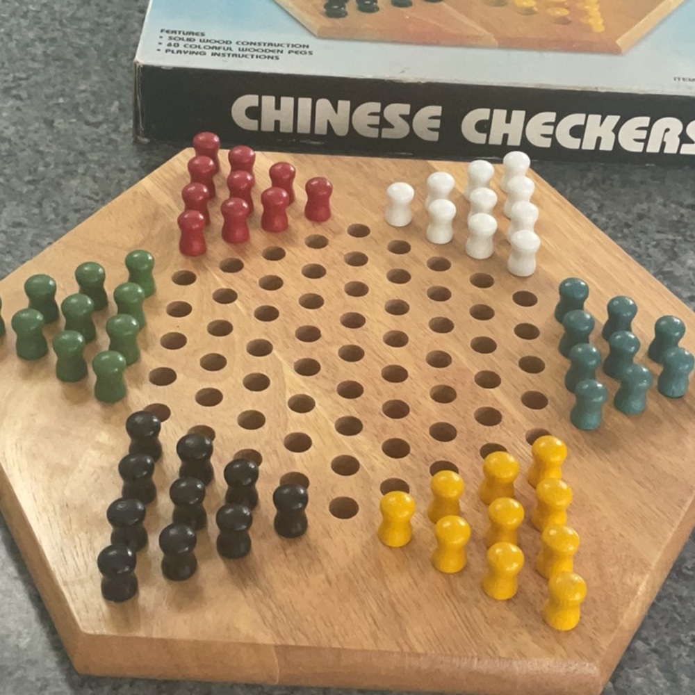 Vintage Chinese Checkers wood board and pegs.
